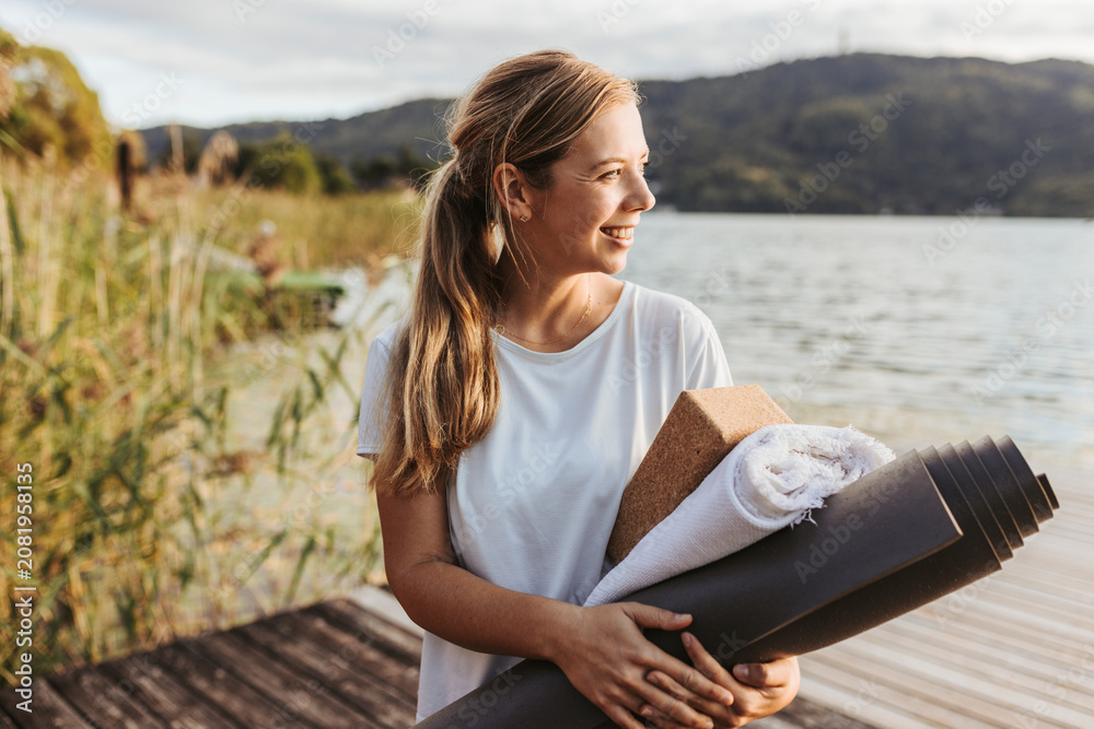 Guest carrying a mat down to the water